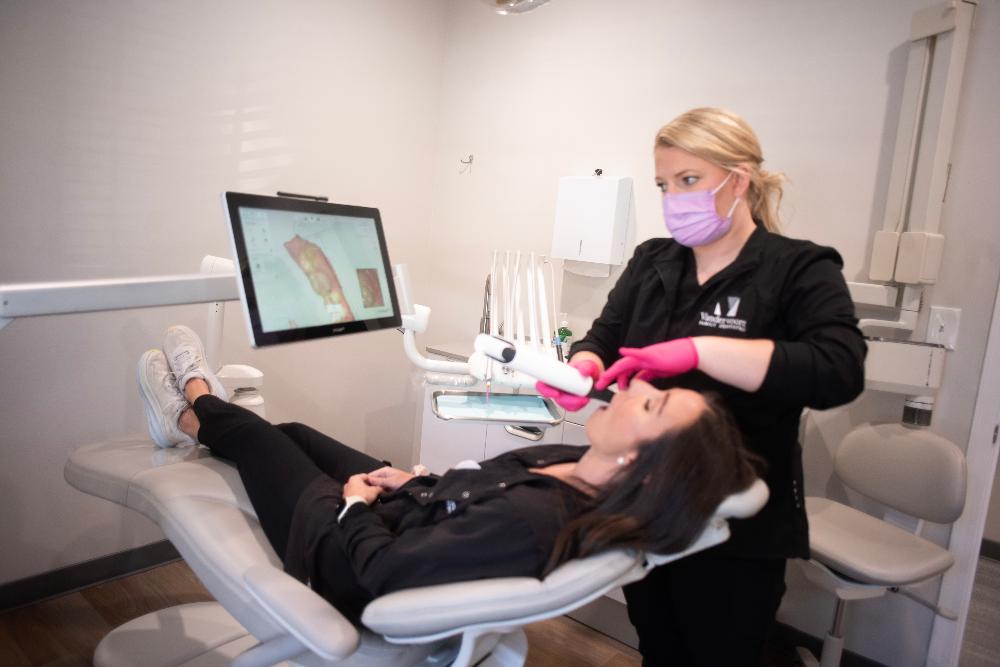 team member using intraoral camera 