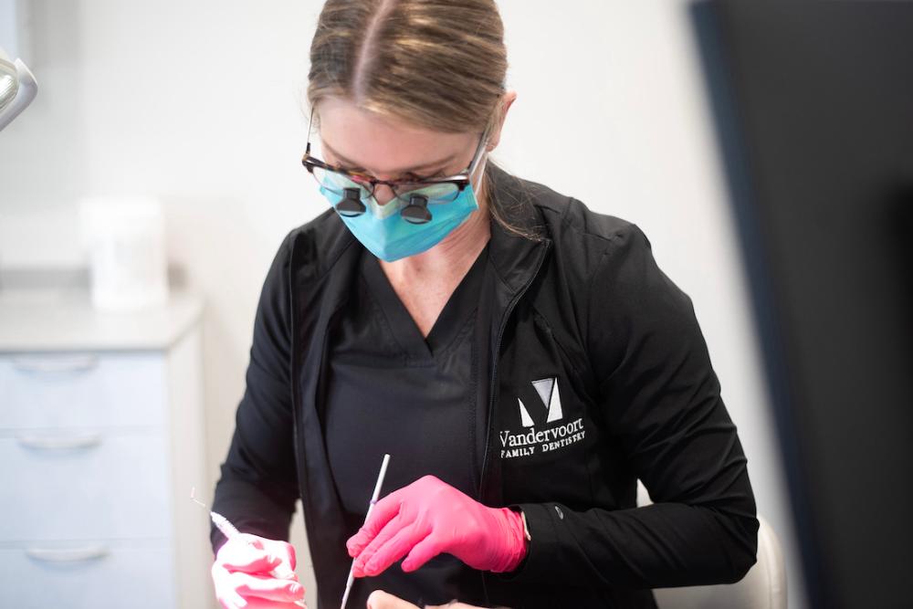 vandervoort family dentistry team member helping patient, northport al