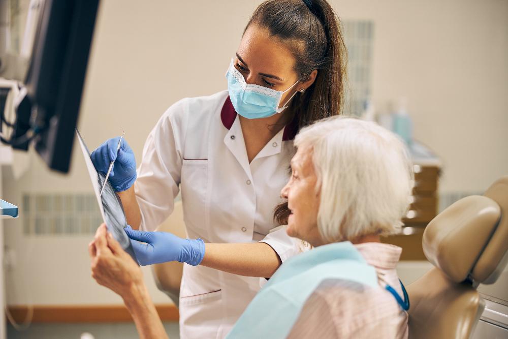 Dentist with older woman patient, tuscaloosa al