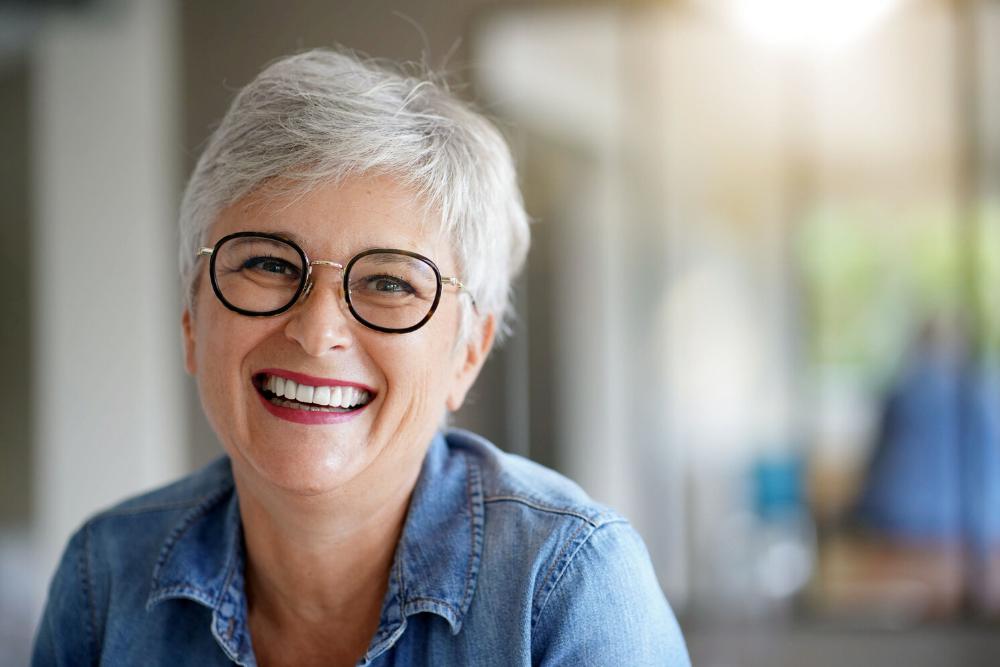 woman smiling after getting implants in tuscaloosa