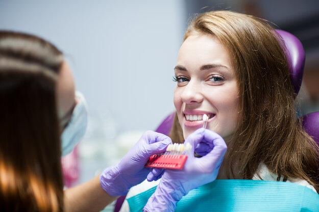 woman getting in office teeth whitening in Tuscaloosa