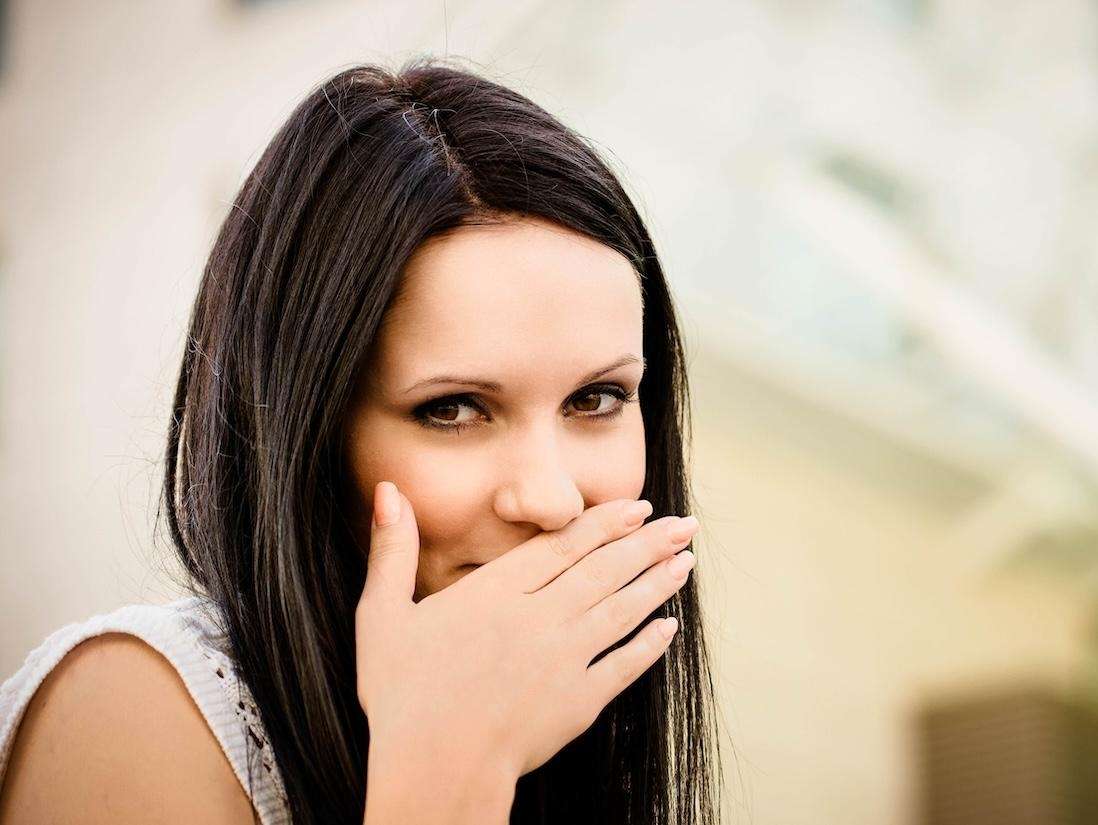 Woman covering her mouth, tuscaloosa al