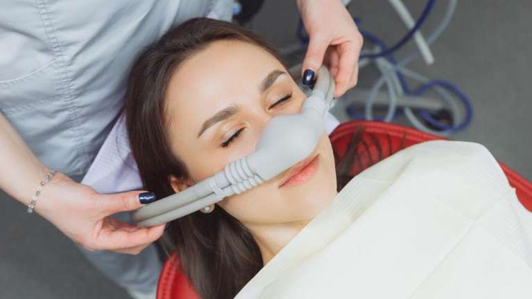 woman getting dental sedation at a Tuscaloosa dental office