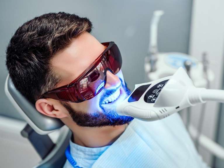Man in dental chair getting his teeth whitened, Tuscaloosa AL