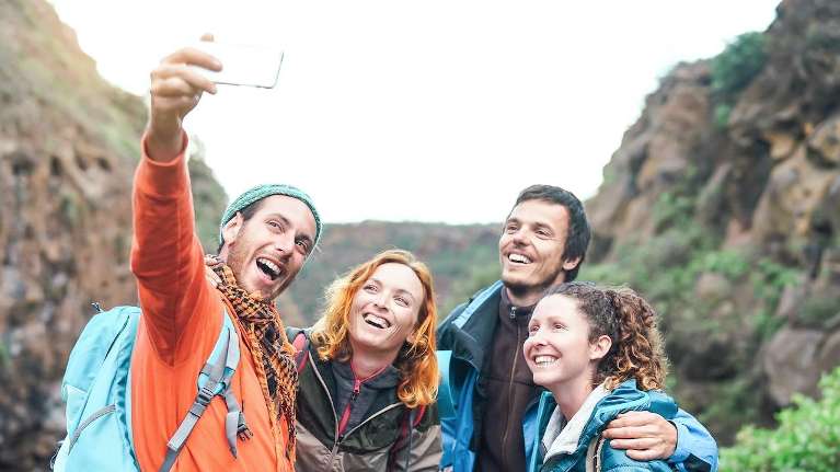 Group of friends taking a selfie together on a hike, tuscaloosa al