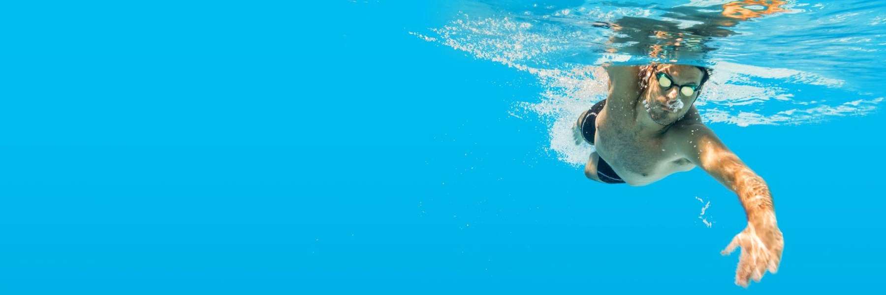 Man swimming with goggles, tuscaloosa al