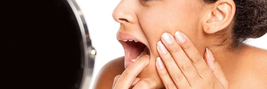 Woman checking her mouth for enamel erosion, tuscaloosa al